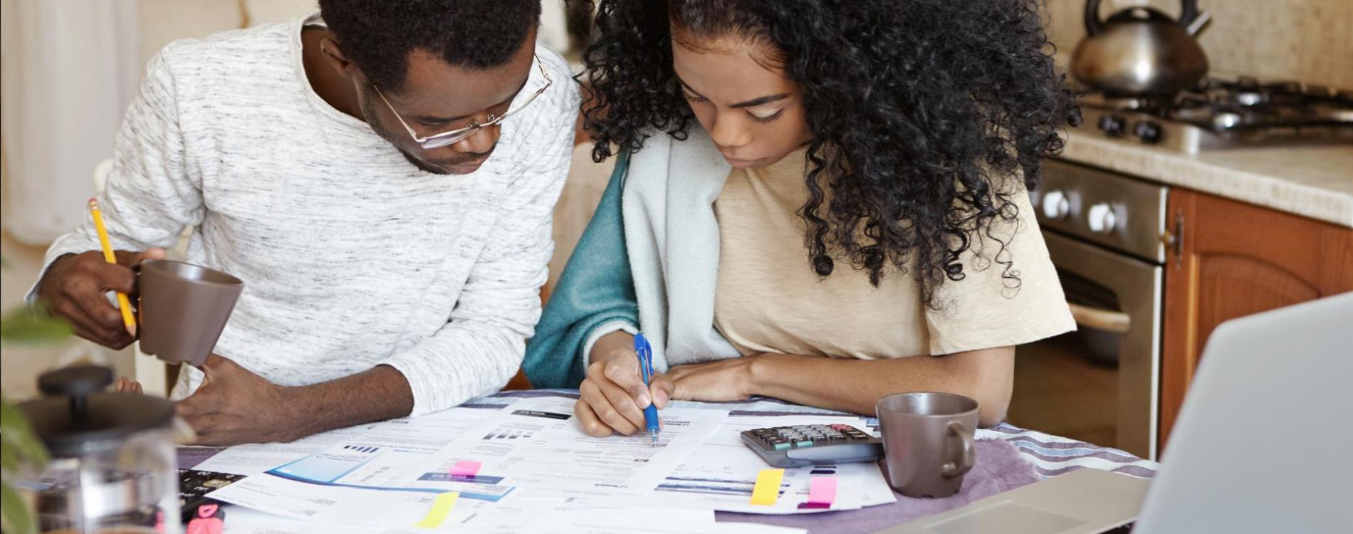 Young couple of African descent working on finances